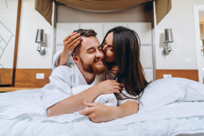 Picture showing happy couple resting in hotel room