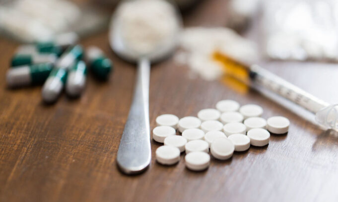 close-up-of-drugs-money-spoon-and-syringe-5e550d57a9db3